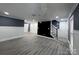 Spacious room with luxury vinyl plank flooring, recessed lighting, and modern design throughout at 7310 Yorkville Ct, Charlotte, NC 28273