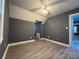 Bedroom showing neutral walls, ceiling fan and wood-look floor at 7310 Yorkville Ct, Charlotte, NC 28273