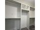 Walk-in closet offers ample storage space with built-in shelving and hanging rods at 7310 Yorkville Ct, Charlotte, NC 28273