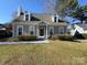 Charming home with a well-maintained front yard, fresh exterior paint, and eye-catching architectural details at 7310 Yorkville Ct, Charlotte, NC 28273