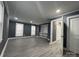 Spacious living room with luxury vinyl plank flooring, natural light, and open closet space at 7310 Yorkville Ct, Charlotte, NC 28273