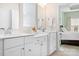 Ensuite bathroom features a double sink vanity, modern fixtures, and tile flooring at 781 Hazel Way, Denver, NC 28037