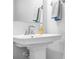 Clean and well-maintained pedestal sink in a bathroom, complemented by chrome fixtures and decorative towels at 781 Hazel Way, Denver, NC 28037