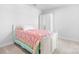 Bright bedroom with a white framed bed and simple décor at 781 Hazel Way, Denver, NC 28037