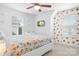 Light and airy bedroom with modern furniture, TV, and colorful decor at 781 Hazel Way, Denver, NC 28037