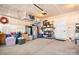 Spacious garage with overhead storage racks and ample space for organizing tools and storing belongings at 781 Hazel Way, Denver, NC 28037