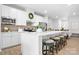 Stylish kitchen featuring a large island with seating, stainless appliances, and white cabinetry at 781 Hazel Way, Denver, NC 28037