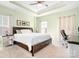Relaxing main bedroom features a tray ceiling, carpeted floor, sitting area, and a large window at 781 Hazel Way, Denver, NC 28037
