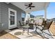 Inviting covered patio with comfortable seating arrangement, ideal for enjoying outdoor leisure and gatherings at 781 Hazel Way, Denver, NC 28037