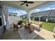 Relaxing covered patio with ceiling fan, furniture, and stylish rug for outdoor enjoyment at 781 Hazel Way, Denver, NC 28037
