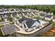 Community clubhouse and pool, surrounded by lush greenery, landscaped grounds, and newly-built townhomes at 781 Hazel Way, Denver, NC 28037