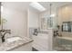 Primary bathroom with separate soaking tub, glass shower and granite countertops at 8807 Thornbury Ln, Huntersville, NC 28078