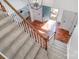 View of the home's foyer from the staircase, showcasing hardwood floors and blue front door at 8807 Thornbury Ln, Huntersville, NC 28078