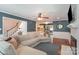 Cozy living room with hardwood floors, fireplace, wainscoting, and a comfortable sectional sofa at 8807 Thornbury Ln, Huntersville, NC 28078