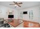 Bright office space with hardwood floors, natural light, and a spacious work area at 8807 Thornbury Ln, Huntersville, NC 28078