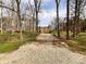 Private residence with a gravel driveway enclosed by a gate, offering added security and a sense of seclusion at 905 Kemper Cir, Rock Hill, SC 29732