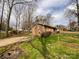 Home featuring a spacious backyard, fenced perimeter, and mature trees, perfect for outdoor activities and privacy at 905 Kemper Cir, Rock Hill, SC 29732