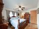 Bright bedroom with wooden floors, complemented by a ceiling fan and natural light from the window at 905 Kemper Cir, Rock Hill, SC 29732