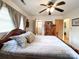 Comfortable bedroom featuring a wooden bed frame, ceiling fan, and natural light from the window at 905 Kemper Cir, Rock Hill, SC 29732