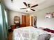 Cozy bedroom with a decorative dresser, closet and a wooden bed frame, featuring a ceiling fan at 905 Kemper Cir, Rock Hill, SC 29732