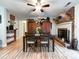 Cozy dining room with hardwood floors and a brick fireplace, perfect for gatherings at 905 Kemper Cir, Rock Hill, SC 29732