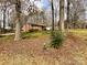 Traditional brick home with well-kept landscaping, a private driveway, and mature trees providing ample shade at 905 Kemper Cir, Rock Hill, SC 29732