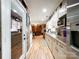Bright kitchen flowing into dining area, featuring white cabinets and stainless-steel appliances at 905 Kemper Cir, Rock Hill, SC 29732