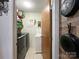 Laundry room with a large washer and dryer, utility sink, and shelving for storage at 905 Kemper Cir, Rock Hill, SC 29732