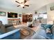Comfortable living area featuring ceiling fan, hardwood floors, and open concept to kitchen at 905 Kemper Cir, Rock Hill, SC 29732
