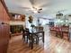 Open floorplan joining dining and kitchen featuring hardwood floors and lots of natural light at 905 Kemper Cir, Rock Hill, SC 29732