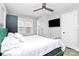 Spacious bedroom features hardwood floors, a mounted television, and natural light at 914 Crestmere St, Charlotte, NC 28208
