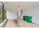 View of a spacious carport featuring white brick walls and double doors, with a glimpse of the red front door at 914 Crestmere St, Charlotte, NC 28208