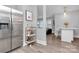 View of the kitchen area into the living room featuring stainless steel refrigerator at 914 Crestmere St, Charlotte, NC 28208