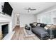 Spacious living room with a stylish fireplace, cozy seating, and hardwood floors, offering a welcoming atmosphere at 914 Crestmere St, Charlotte, NC 28208