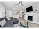 Bright and airy living room with a modern fireplace, comfortable seating, and an open layout to the kitchen at 914 Crestmere St, Charlotte, NC 28208