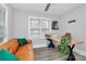 Well-lit office featuring hardwood floors, a comfortable leather couch, and an exterior view at 914 Crestmere St, Charlotte, NC 28208