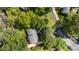 Aerial view of a home with mature trees, lawn, and landscaping in a residential neighborhood at 917 Bobby Ln, Charlotte, NC 28211