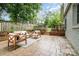 Cozy backyard patio with outdoor furniture and attractive stamped concrete design at 917 Bobby Ln, Charlotte, NC 28211