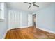 Bedroom with hardwood floors, ceiling fan, and closet at 917 Bobby Ln, Charlotte, NC 28211