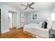 Charming bedroom with hardwood floors, ceiling fan, and plenty of natural light at 917 Bobby Ln, Charlotte, NC 28211