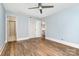 Spacious bedroom with a ceiling fan, closet, and beautiful wood-look flooring at 917 Bobby Ln, Charlotte, NC 28211