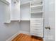 Walk-in closet with custom shelving and drawers for optimal storage at 917 Bobby Ln, Charlotte, NC 28211