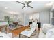 Bright living room with hardwood floors, comfortable seating, and an open dining area at 917 Bobby Ln, Charlotte, NC 28211