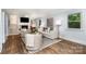 Bright living room featuring a fireplace, neutral decor, and hardwood floors at 917 Bobby Ln, Charlotte, NC 28211