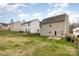 Backyard showing fencing and view of neighboring houses at 10228 Seedling Ln, Charlotte, NC 28214