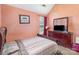 Bedroom featuring a window, dresser with television, and a bed with a patterned comforter at 10228 Seedling Ln, Charlotte, NC 28214