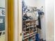 Walk-in closet with open shelving for shoes and hanging clothes at 10228 Seedling Ln, Charlotte, NC 28214