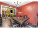 Cozy dining room with a wooden table, four chairs, and view to living room, perfect for Gathering meals at 10228 Seedling Ln, Charlotte, NC 28214