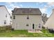 Back exterior with siding, windows, and patio at 10228 Seedling Ln, Charlotte, NC 28214