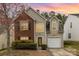 Charming two-story home featuring a mix of brick and siding, complemented by manicured shrubs and a well-maintained lawn at 10228 Seedling Ln, Charlotte, NC 28214